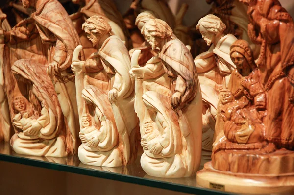 Row of wooden figures — Stock Photo, Image