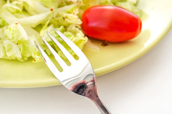 Vegetables salad served on a yellow plate — Stock Photo, Image