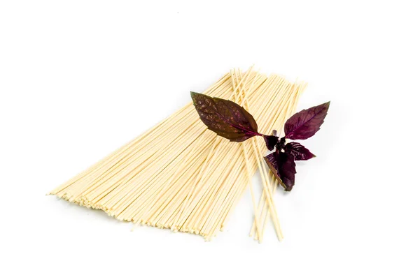 Spaghetti decorated with some basil — Stock Photo, Image