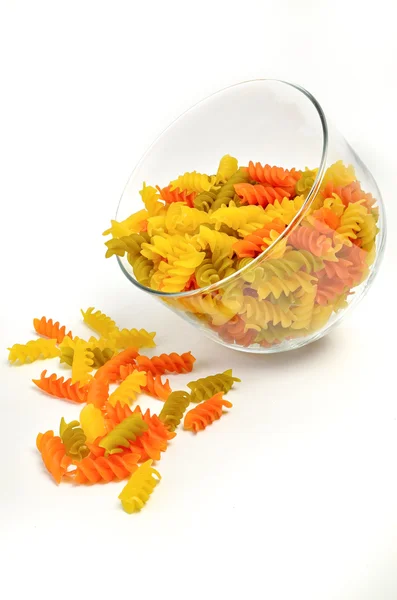 Multicolored rotini pasta on a white background — Stock Photo, Image