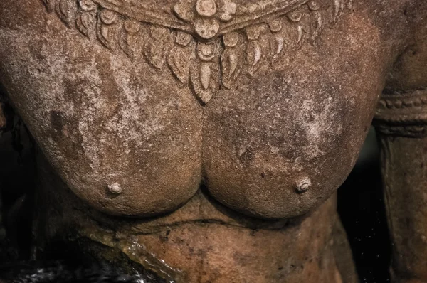 Stone statue with focus on breast — Stock Photo, Image