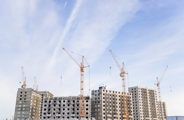 Construction site with cranes on sky background — Stock Photo, Image