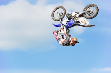 PENZA, RUSSIA - JUNE 18, 2011: A professional rider at the FMX Freestyle Motocross competition at motorshow Night Of The Jumps clipart