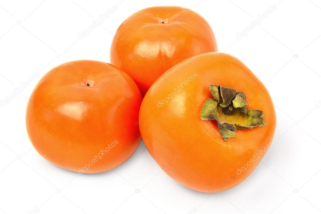 Ripe persimmons isolated on a white cutout.