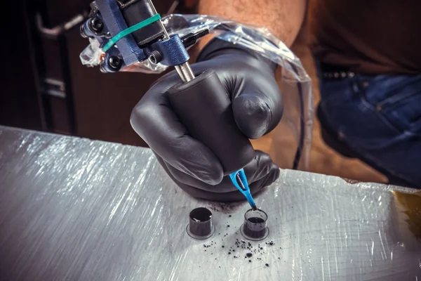 Studio showing process of making a tattoo — Stock Photo, Image