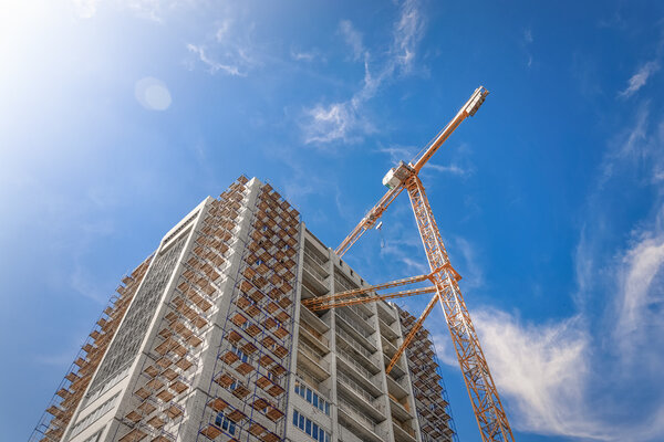 Construction of new skyscraper and construction cranes
