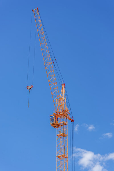 The site with cranes against blue sky