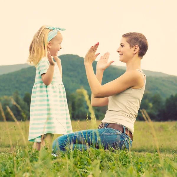 Mother and daughter time, family playing outdoors — Stock Photo, Image