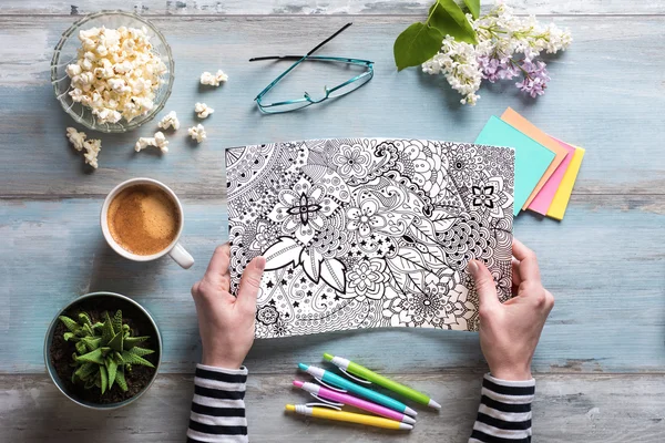 Flat lay, female coloring adult coloring books, new stress relieving trend — Stock Photo, Image