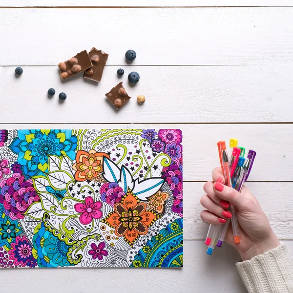 Flat lay, female coloring adult coloring books, new stress relieving trend — Stock Photo, Image