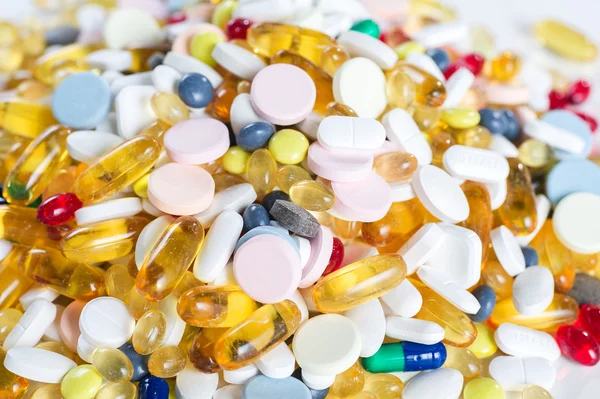 Many different colorful medication and pills from above isolated on white background — Stock Photo, Image