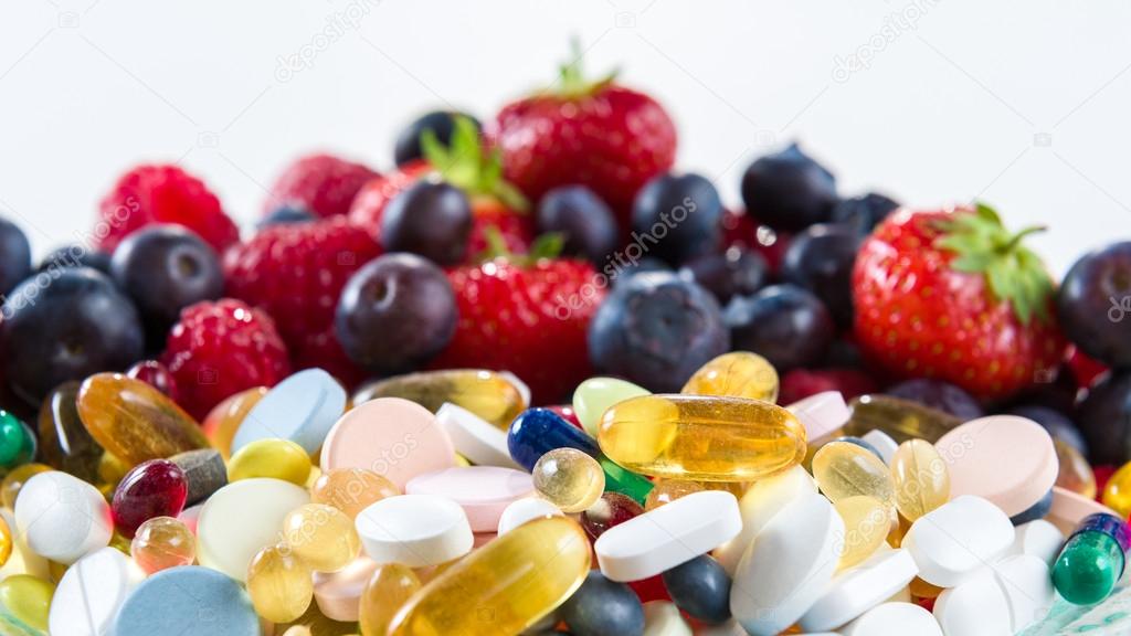 Healthy lifestyle, diet concept, Fruit and pills, vitamin supplements with on white background