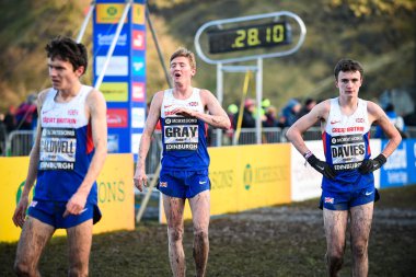 EDINBURGH, SCOTLAND, UK, January 10, 2015 - elite athletes exhausted after the Great Edinburgh Cross Country Run. This Men's 8k race was won by last year's champion Chris Derrick. clipart
