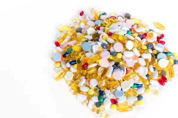 Many different colorful medication and pills from above on white background with copy space — Stock Photo, Image