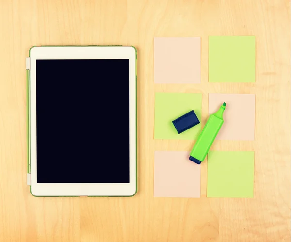 Office table with digital tablet, highlighter and sticky notes. View from above with copy space — Stock Photo, Image