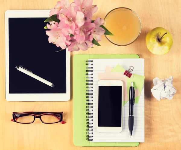 Office table with digital tablet, smartphone, reading glasses and healthy breakfast. View from above with copy space — Stock Photo, Image