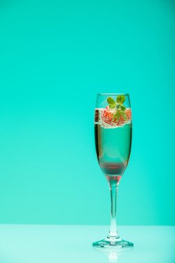 Champagne glass with strawberry, studio shot with light effects