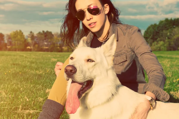 Young attractive girl with her pet dog, colorised image — Stock Photo, Image