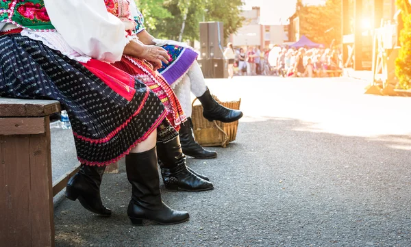 Anonymous senior female friends in folklore costumes — Stock Photo, Image