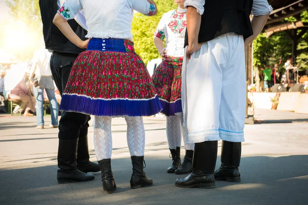 Anonymous group of people in folklore costumes — Stock Photo, Image