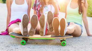 Hipster teenage friends with skateboard, colorised image clipart