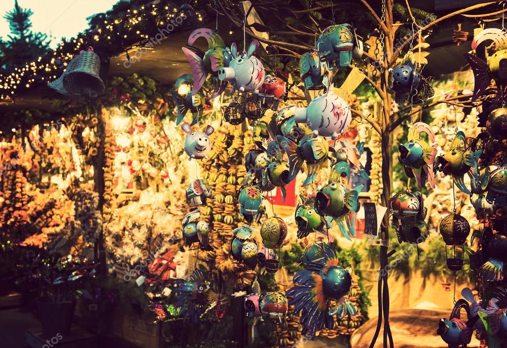 Illuminated Christmas fair kiosk with loads of shining decoration merchandise, no logos