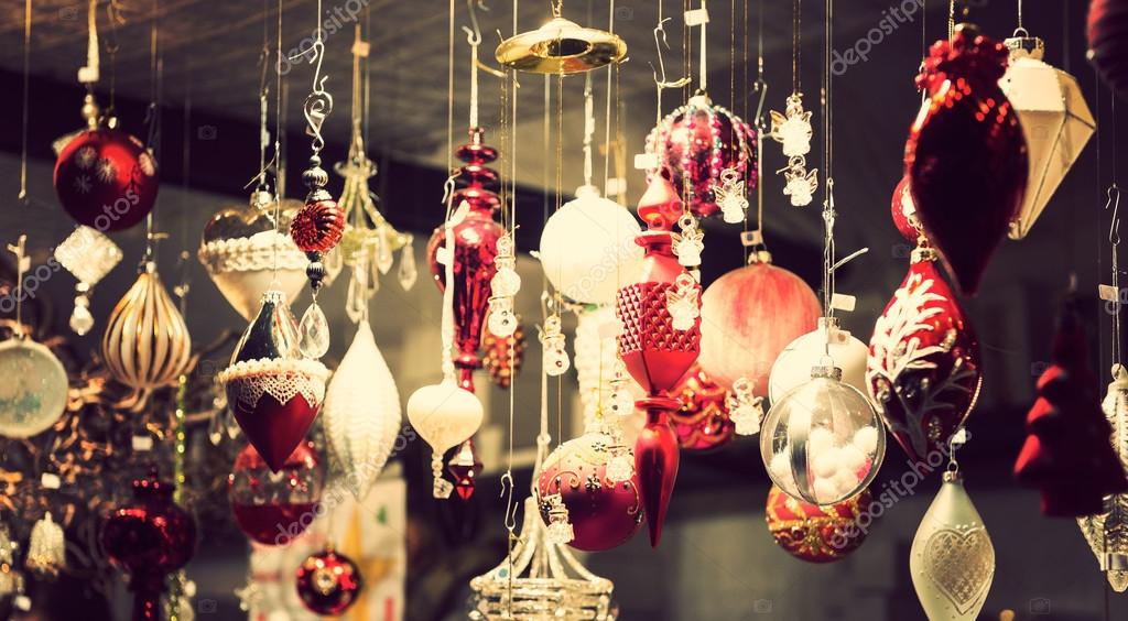 Illuminated Christmas fair kiosk with loads of shining decoration merchandise, no logos