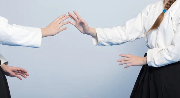 Two girls in black hakama practice Aikido — Stock Photo, Image