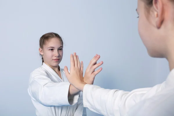 Two girls in black hakama practice Aikido — Stock Photo, Image