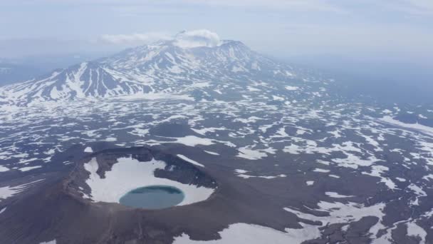 Gorely Volcano crater lake with Mutnovsky Volcano on the background. Kamchatka, Russia — Stock Video