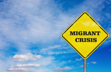 A road sign Migrant Crisis on sky background clipart
