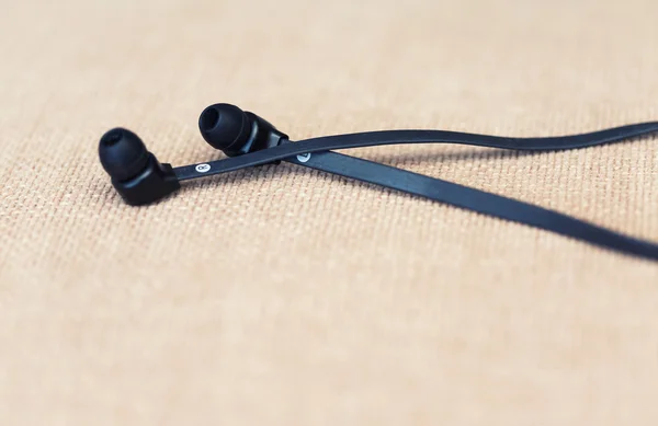 Modern flexible audio earphones on a textile