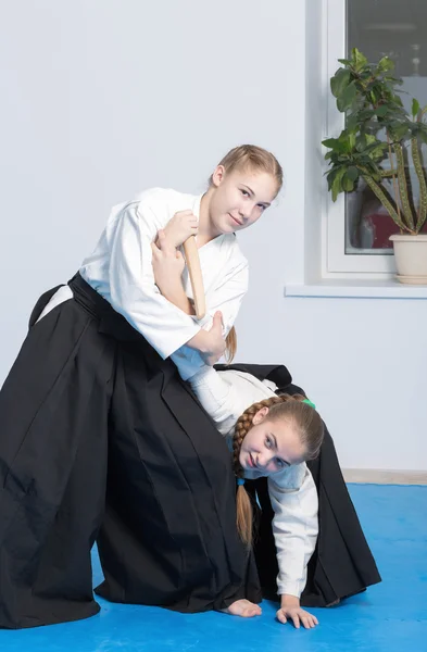 Two girls on Aikido training on white background — Stock Photo, Image