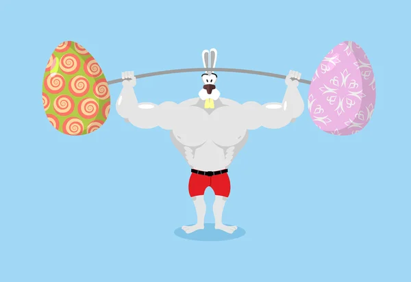 Silný králík drží barbela a velikonoční vajíčka. Sport pro zajíce. — Stockový vektor