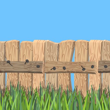 Ahşap çit ve mavi gökyüzü. Eski ahşap plakalar ve yeşil çim. Fe