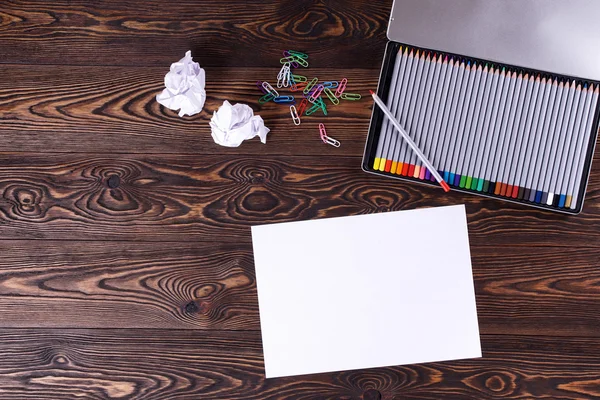 Colored pencils. Sheet of paper. The jammed paper. — Stock Photo, Image