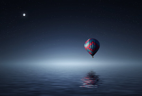 Air balloon flying over  water