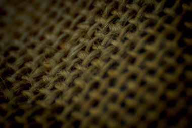 Kenevir kumaş yakın plan, lifler arasında boşluklar olan kahverengi iplikler, yüksek büyütme, süper makro, görüş merkezi..