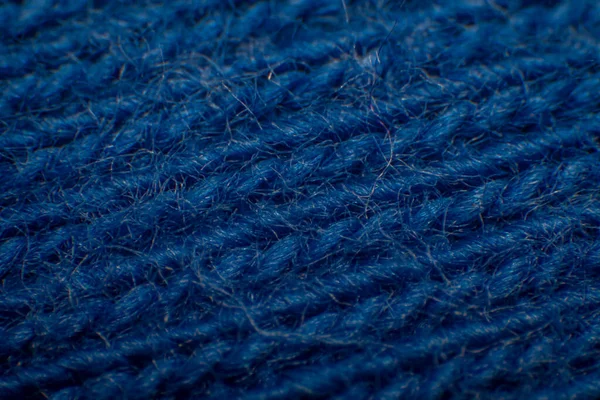 Close-up of synthetic fabric, Blue fiber with gaps, High magnification, Super macro.