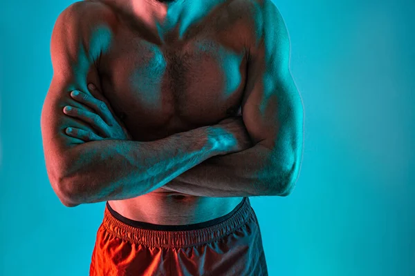 Naked torso of athletic man with crossed arms — Stock Photo, Image