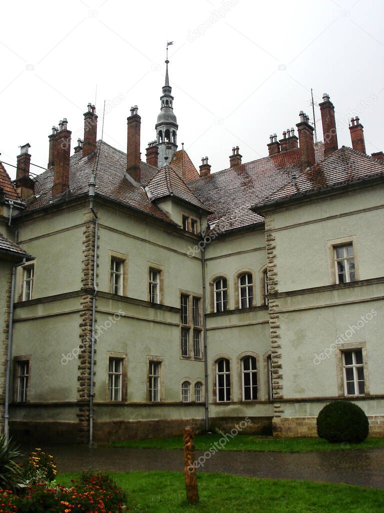 Shenborn Castle building with windows and wet red tiled roof with towers at Shenborn Palace