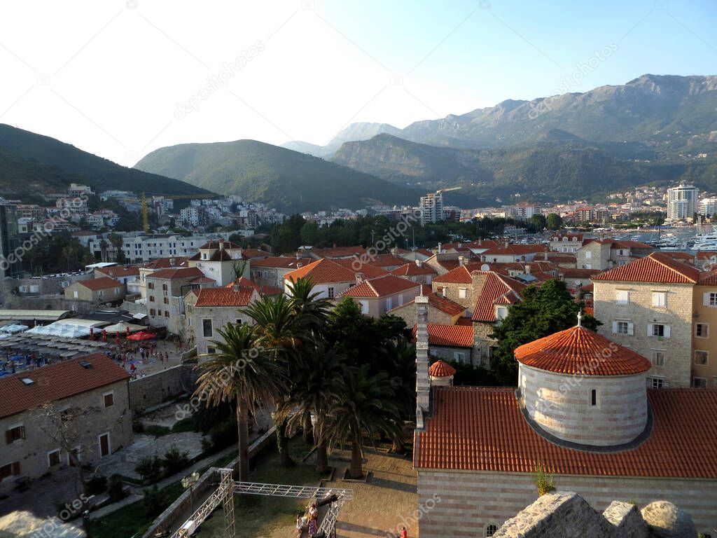 Street cafe in the fresh air in the citadel of the old city. Sea bay and mountains