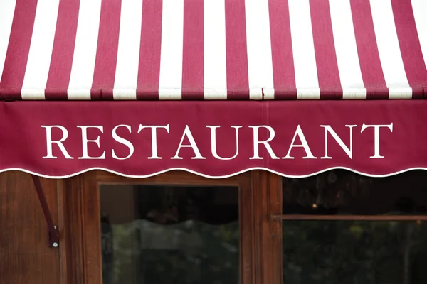 Striped french restaurant canopy in Paris france. — Stock Photo, Image