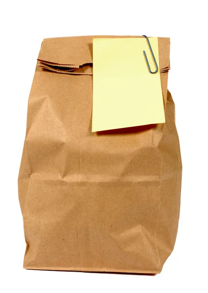 Sacchetto di carta marrone pranzo o generi alimentari con posta gialla è stile nota appiccicosa — Foto Stock