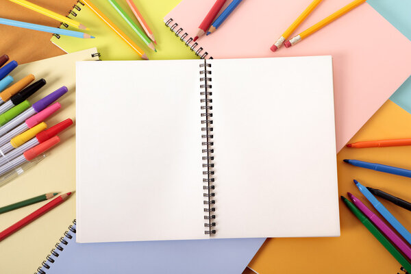 Student's desk with blank notebook
