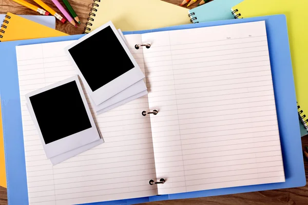 Photo album open with several blank polaroid style photo print f — Stock Photo, Image