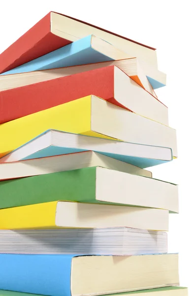 Untidy stack of colorful paperback books — Stock Photo, Image