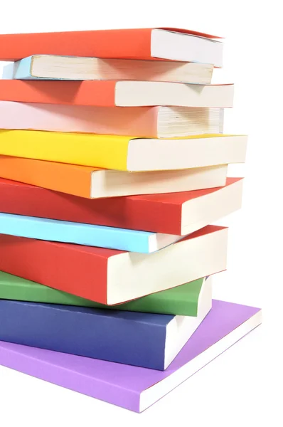 Untidy stack of colorful paperback books — Stock Photo, Image