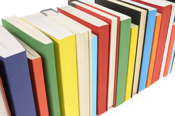 Neat row of colorful paperback books — Stock Photo, Image