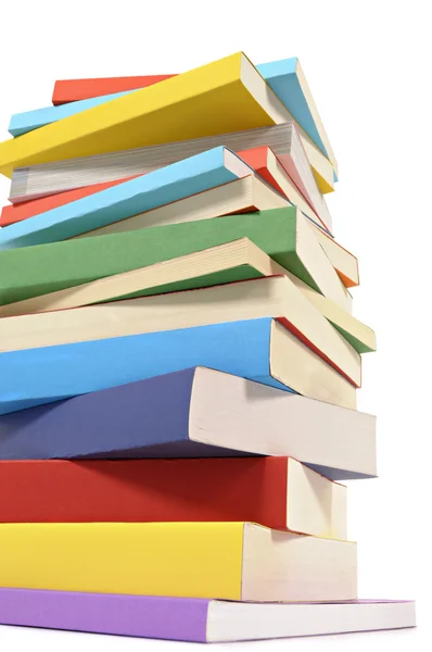 Untidy stack of colorful paperback books — Stock Photo, Image